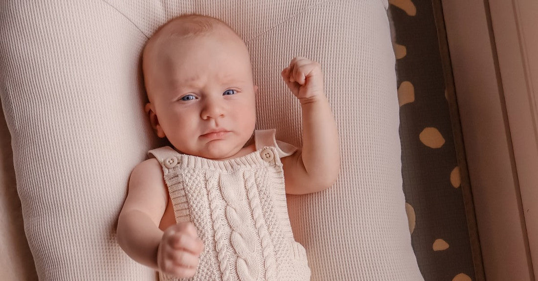 baby calmly chilling in the baby pod