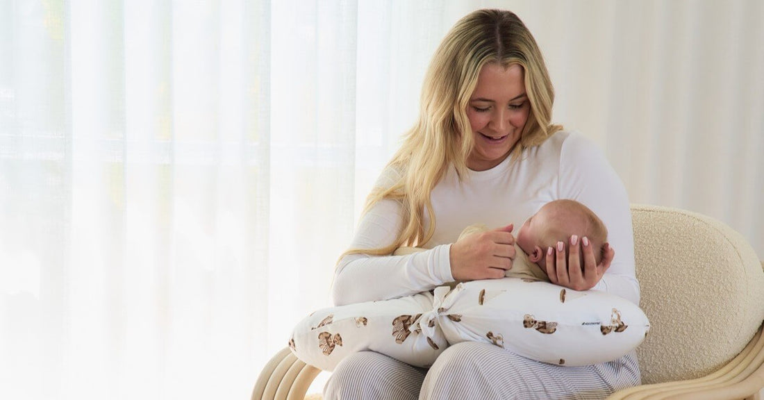 mom and baby bonding and using a breastfeeding pillow for support